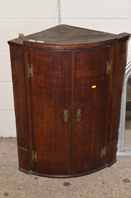 Lot 397 - A Georgian oak two door corner cabinet
