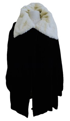 Lot 85 - A black velvet fur trimmed evening jacket,...