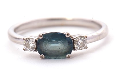 Lot 53 - A 9ct sapphire and diamond ring, the oval blue-...