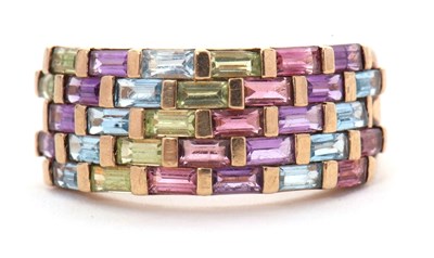 Lot 37 - A multi gemset ring, the broad ring set with...
