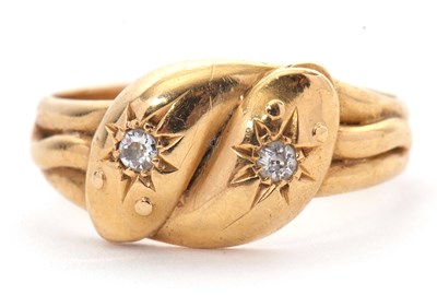 Lot 75 - An 18ct diamond snake ring, the double headed...