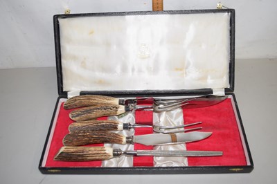 Lot 11 - A horn handled carving set