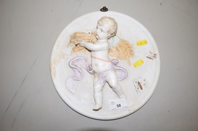 Lot 58 - A porcelain cherub wall plaque
