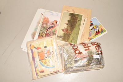 Lot 111 - A box of various assorted postcards, cigarette...