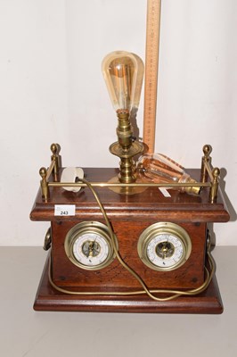 Lot 243 - A novelty hardwood cased combination desk lamp,...