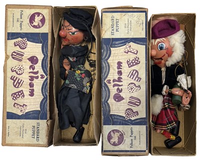 Lot 466 - A pair of vintage boxed Pelham puppets, to...