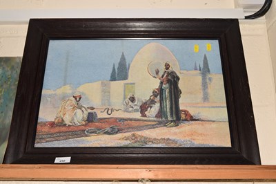 Lot 250 - Coloured print seated Arab figures with snake...