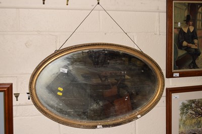 Lot 264 - A bevelled wall mirror in gilt finished frame