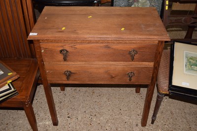Lot 321 - An early 20th Century oak two drawer chest
