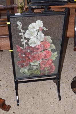 Lot 332 - A Victorian fire screen with central floral...
