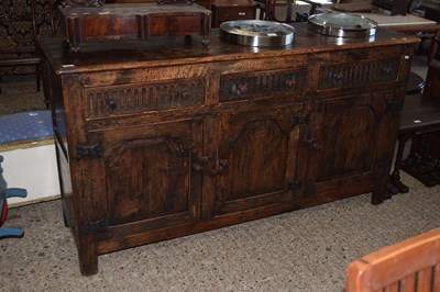 Lot 351 - A reproduction oak three door, three drawer...