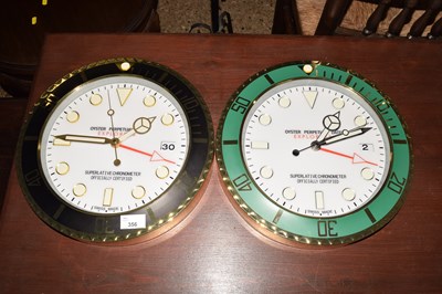 Lot 356 - Two Rolex style wall clocks marked Oyster...
