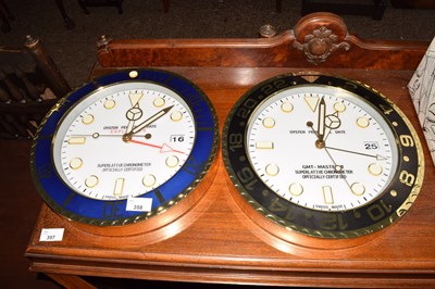 Lot 358 - Two Rolex style wall clocks marked Oyster...