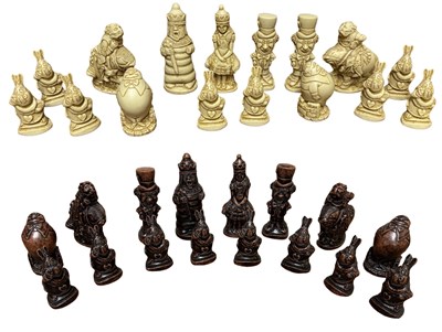 Lot 423 - A set of composite chess pieces formed as...