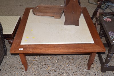Lot 382 - A hardwood framed coffee table with stone centre