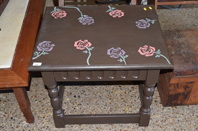 Lot 383 - A painted hardwood coffee table with rose...