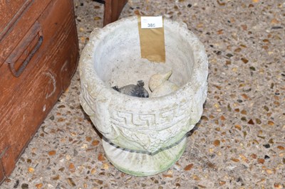 Lot 385 - A small concrete planter and garden ornaments
