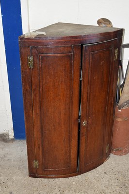 Lot 394 - A Georgian oak corner cabinet