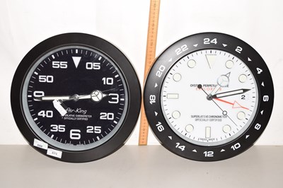 Lot 673 - A Rolex style wall clock together with an...