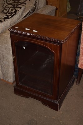 Lot 811 - A glazed front single door cupboard