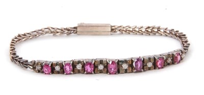 Lot 134 - A diamond and pink sapphire bracelet, the...