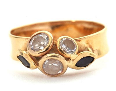 Lot 52 - A custom made gemset ring, set with two...