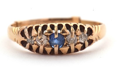 Lot 39 - A sapphire and diamond ring, the central round...