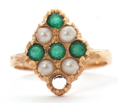Lot 47 - A gemset ring, set with green stones and faux...