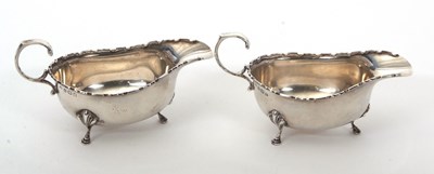 Lot 14 - A pair of George V silver sauce boats of...