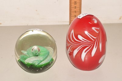 Lot 56 - Two paperweights with floral designs