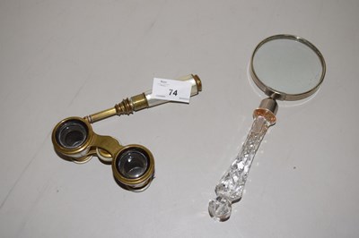 Lot 74 - A pair of opera glasses with mother of pearl...