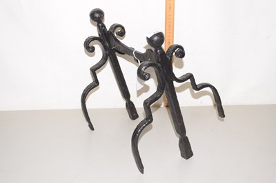 Lot 131 - A metal shaped rest for fireside implements
