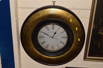Lot 275 - Clock in circular wooden frame with the face...
