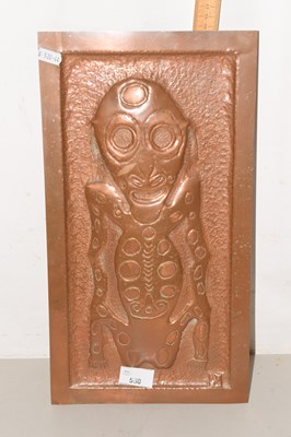 Lot 550 - A copper plaque of a alien