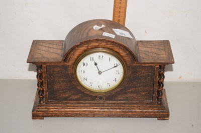 Lot 578 - A small wooden cased over mantel clock,...