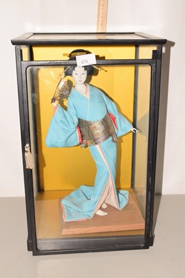 Lot 579 - A cased model of a Geisha girl