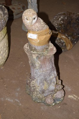 Lot 762 - Concrete model of an owl on tree trunk
