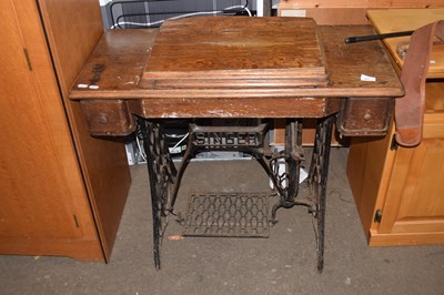 Lot 843 - A Singer sewing machine with work table (a/f)
