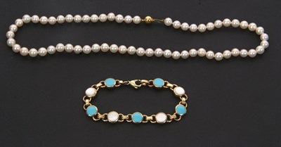 Lot 144 - A mother-of-pearl and turquoise enamel...
