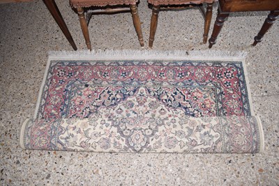 Lot 312 - A pink and blue ground rug