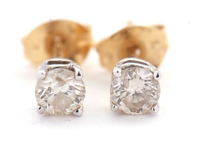 Lot 109 - A pair of 18ct diamond earstuds, the round...