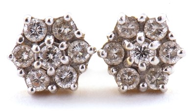 Lot 126 - A pair of 18ct diamond cluster earstuds, set...