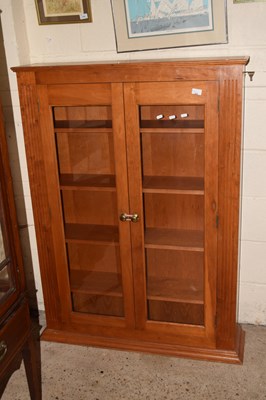 Lot 222 - A two door pine bookcase