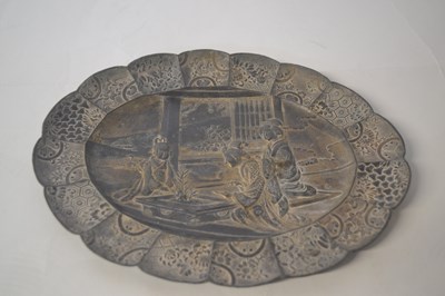 Lot 210 - An oval Japanese metal dish moulded with a tea...
