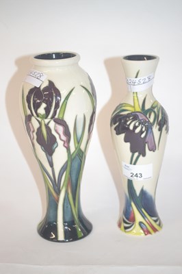 Lot 243 - Two vases, one designed with tubelined flowers...