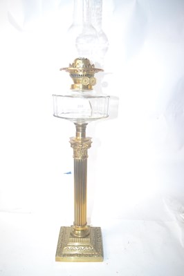 Lot 268 - A late 19th Century brass oil lamp, with glass...