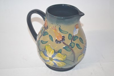 Lot 308 - A Moorcroft jug with tubelined floral...