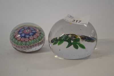 Lot 317 - A Baccarat paperweight together with one other