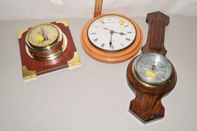 Lot 23 - A wall clock, an oak cased barometer and a...