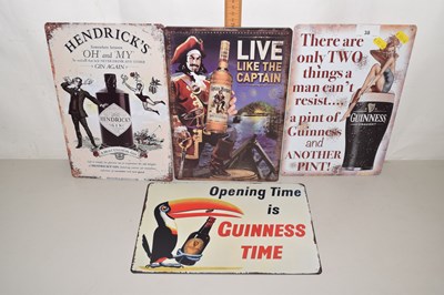 Lot 38 - Four various reproduction metal Guinness and...